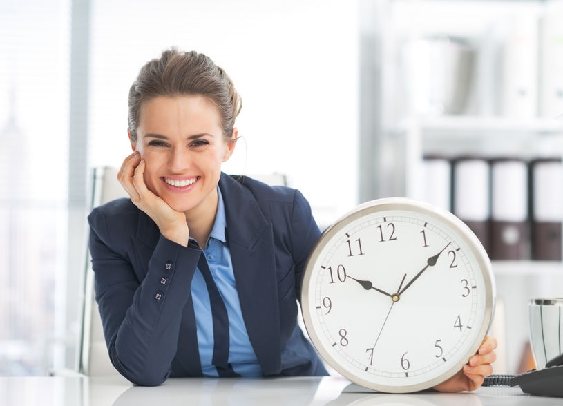 27035886 - happy business woman showing clock